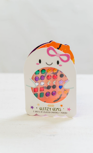 Pack of glittery gems with a cute face design on a white background