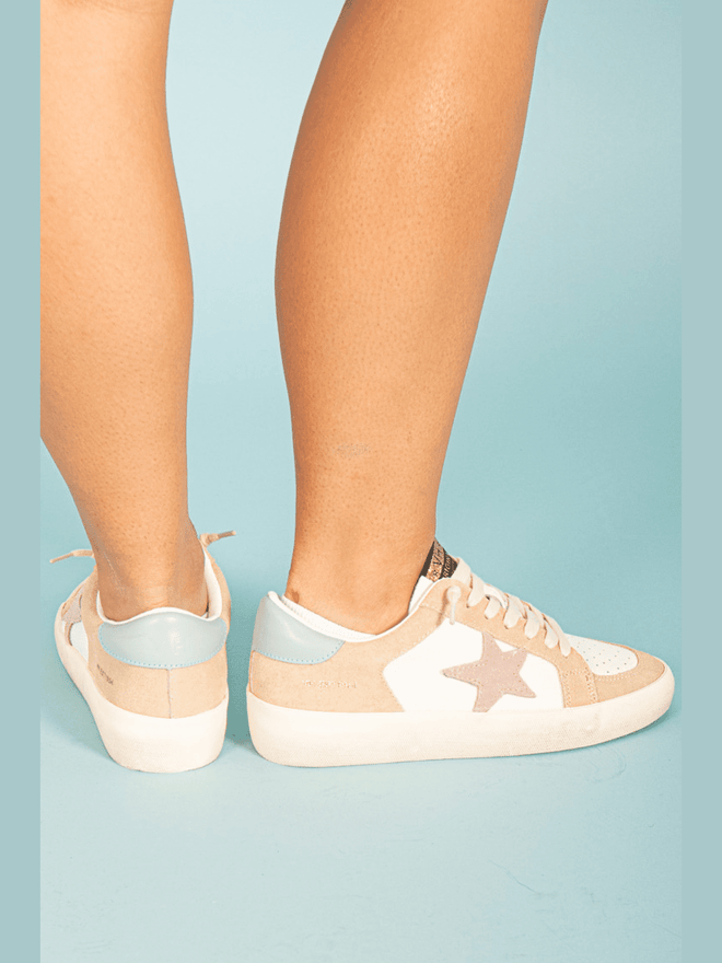 Experience the perfect blend of style and comfort with our Pink Star Beige &amp; White Sneaker! The beautiful pink star design adds a pop of color while the beige and white colors provide a versatile and chic look. Elevate your sneaker game and conquer the day in style!