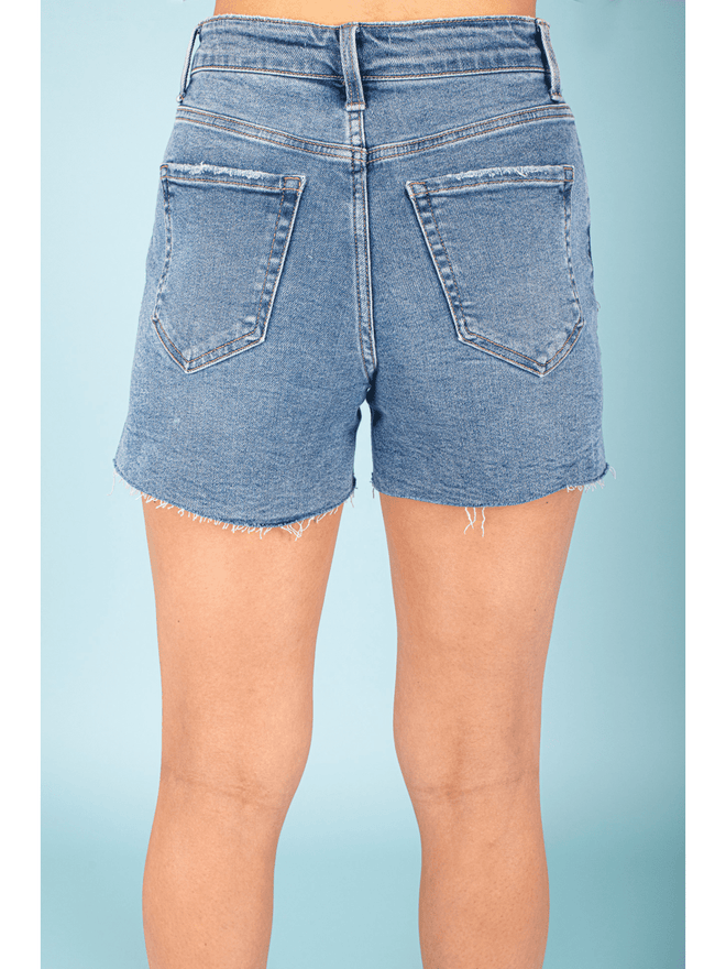Elevate your summer wardrobe with our Side Slit A Line Shorts! Available in classic denim, these shorts feature a modern A-line silhouette with playful side slits. Show off your legs and stay cool in style.
