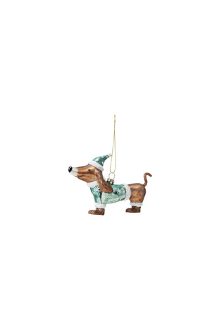 Decorative dog ornament with a patterned coat on a white background