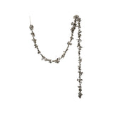 Long necklace with floral-like beads on a white background