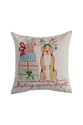 Decorative pillow with a dog wearing reindeer antlers and presents, text 'Making Spirits Bright' on a white background.