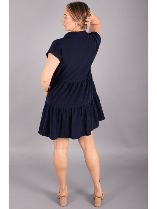 Beautiful navy 3 tier dress with button up front collared neck and front pocket. 