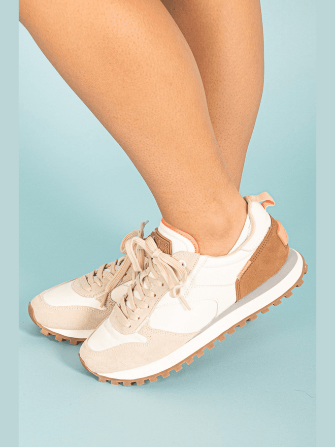 Experience comfort and style with our Brown &amp; Beige Running Sneaker. Made with quality materials, these sneakers provide support and durability. The brown and beige color combination adds a touch of sophistication to your athletic look. Step into these sneakers and elevate your workout game!