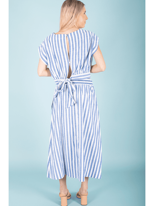 "Transform your look with our Striped Blouse Top! This nautical-inspired top features classic stripes and a unique back tie, adding a touch of elegance to any outfit. You'll feel confident and chic in this must-have piece!"