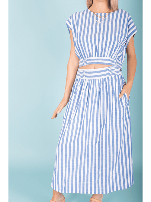 "Transform your look with our Striped Blouse Top! This nautical-inspired top features classic stripes and a unique back tie, adding a touch of elegance to any outfit. You'll feel confident and chic in this must-have piece!"