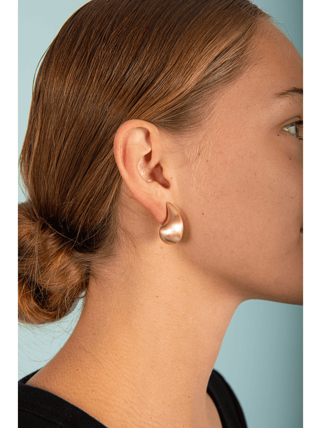 Add a touch of elegance to any outfit with our stunning Matte Tear Drop Earrings! These earrings feature a unique matte finish, adding a sophisticated and modern touch to your look. Perfect for any occasion, you'll feel confident and stylish in these beautiful earrings.
