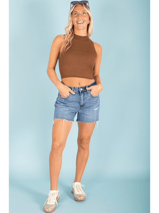 Get ready to turn heads in this light and playful halter neck tank! The lightweight knit material will keep you comfortable and stylish all day long. Perfect for any occasion, this tank is sure to be your new go-to for a fun and flirty look.