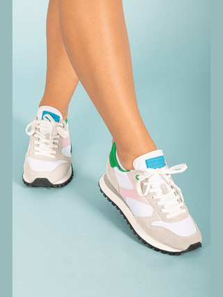 Experience the perfect combination of style and function with our Pink Green &amp; White Running Sneaker! Made with top-quality materials, these sneakers provide both comfort and support for your active lifestyle. Stay ahead of the fashion game while achieving your fitness goals. Step into confidence and run towards your dreams with every stride!