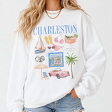 Woman wearing a white Charleston graphic sweatshirt featuring colorful coastal illustrations, blue lettering, and a relaxed fit.