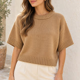 Camel short-sleeve ribbed sweater, styled on a model with ivory trousers
