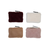 Four fur-textured pouches in different colors on a white background