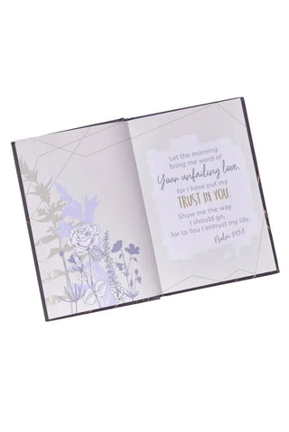 Open card with floral design and text on a white background