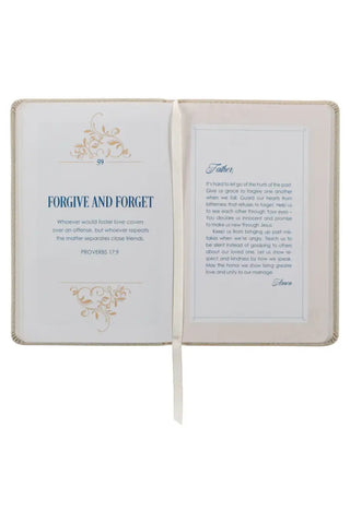 Open book with text and decorative elements on a white background