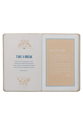 Open book with inspirational text on a white background