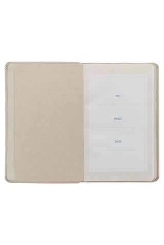 Beige fabric card holder with a white card inside on a white background