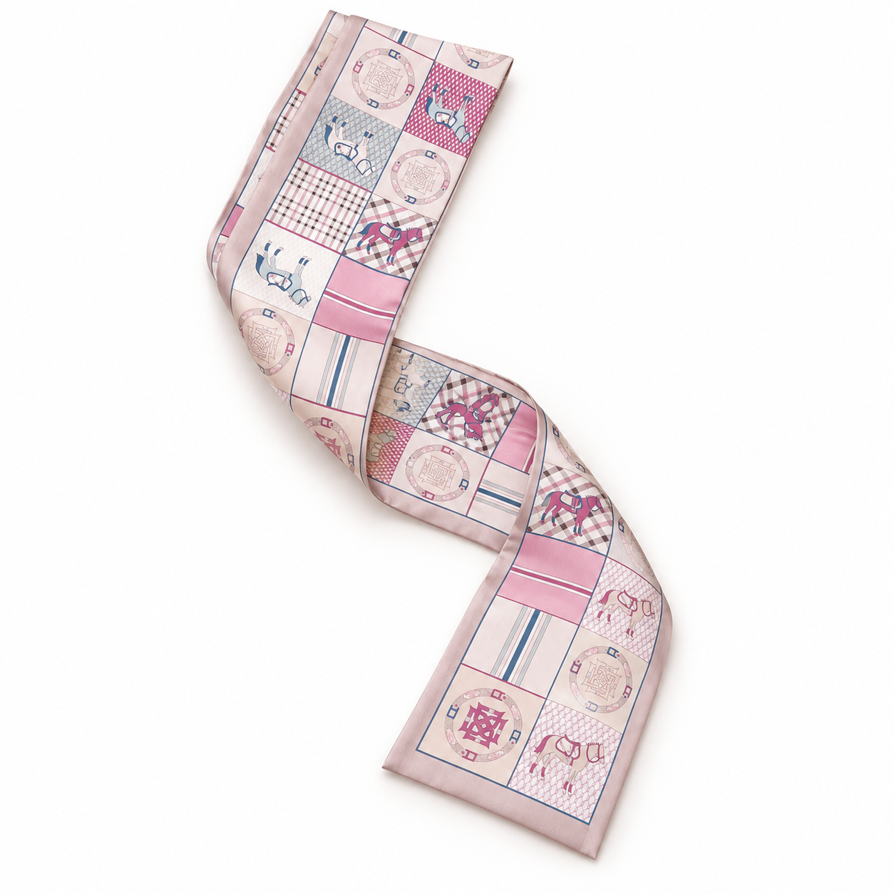Blush pink equestrian patchwork twilly scarf with horse motifs arranged in a curved flat lay on a white background.