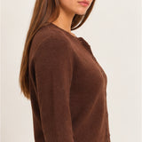 Side view of women's dark brown knit cardigan featuring long sleeves, textured fabric, and a flattering waist-length fit.