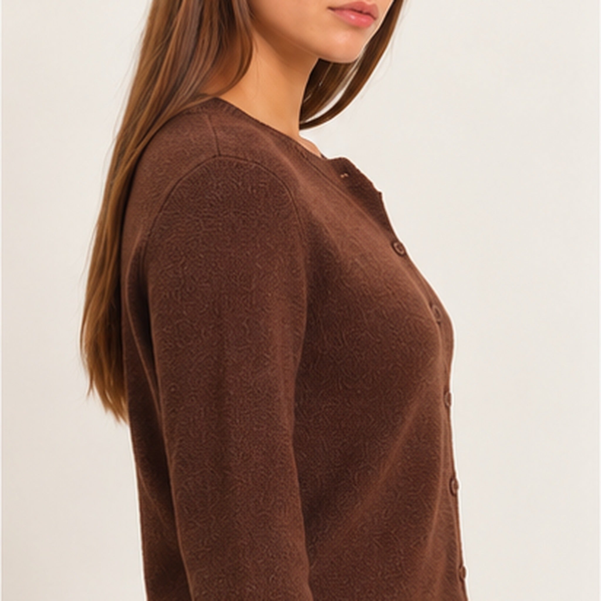 Side view of women's dark brown knit cardigan featuring long sleeves, textured fabric, and a flattering waist-length fit.
