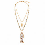 Ceramic fish pendant layered necklace on white