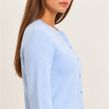 Side view of women's light blue knit cardigan featuring long sleeves, a soft textured finish, and ribbed hem.
