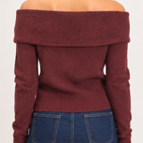 Back view of the Marlowe burgundy off-shoulder knit sweater showing the wide folded neckline, long sleeves, and ribbed waist.