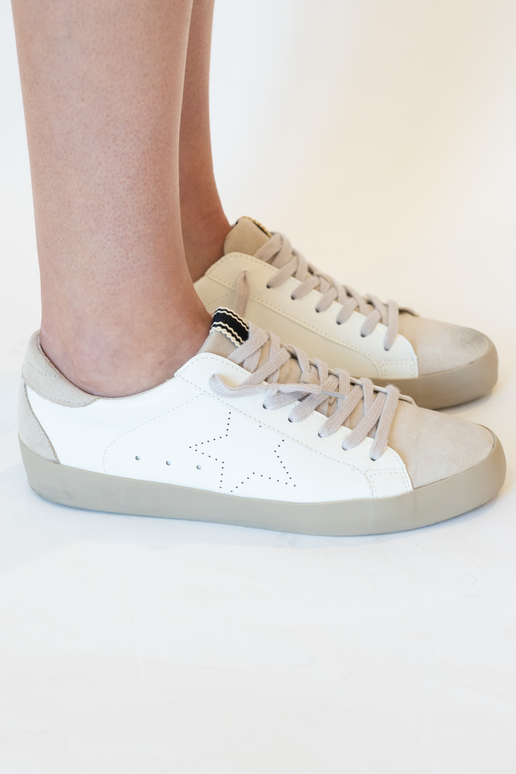 The Mia White Star Sneakers are fashionable sneakers for everyday life. These comfortable sneakers have a loose, low ankle, and look great styled tied or untied. The Mia White Star Sneakers feature a star outline and a suede toe and tongue. These ShuShop Shoes fit true to size.
