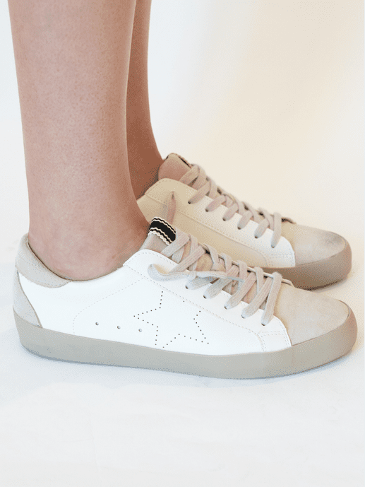 The Mia White Star Sneakers are fashionable sneakers for everyday life. These comfortable sneakers have a loose, low ankle, and look great styled tied or untied. The Mia White Star Sneakers feature a star outline and a suede toe and tongue. These ShuShop Shoes fit true to size.